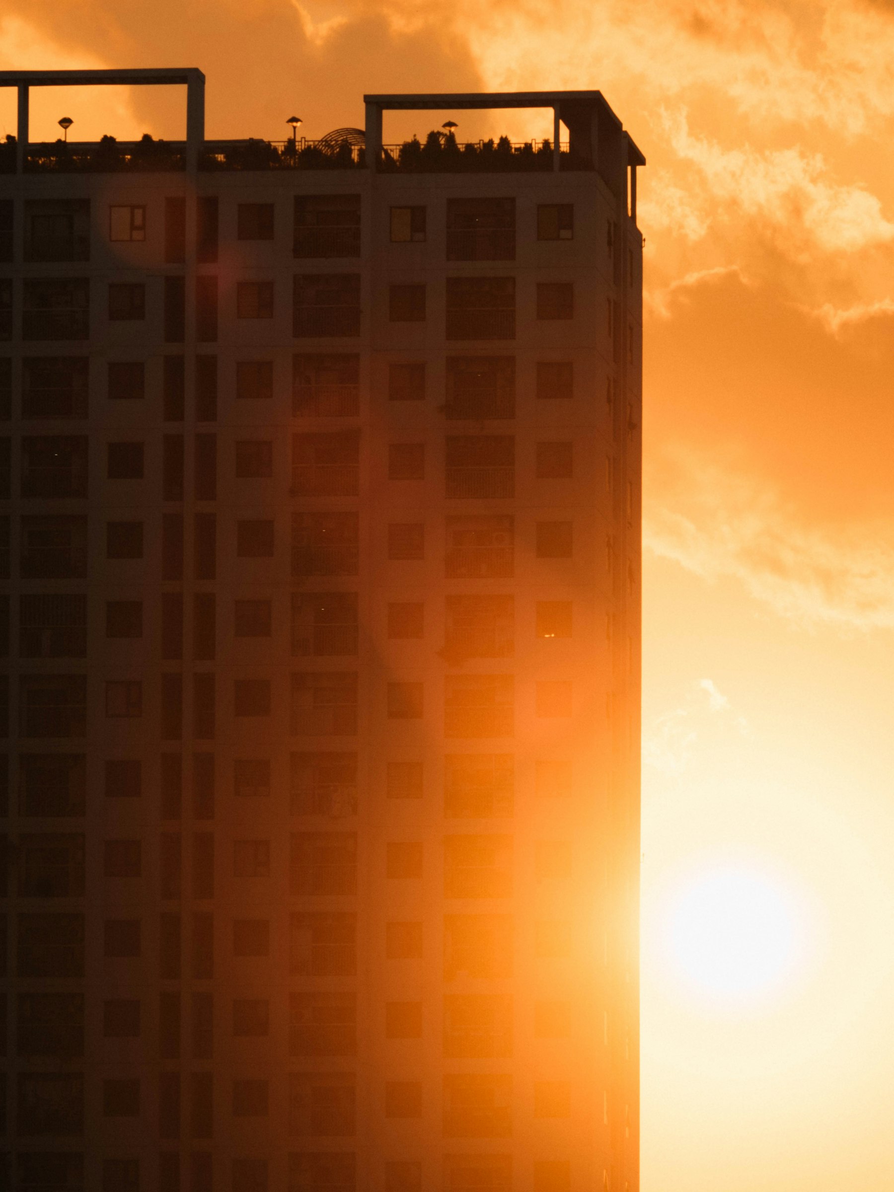 Tower at sunset with the sun setting behind it